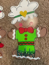 Load image into Gallery viewer, Gingerbread Boy door hanger, Winter Christmas wood cut out hand painted door hanger - DoorBadges
