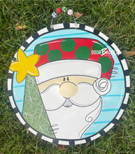 Load image into Gallery viewer, Santa Claus and Tree Door Hanger, Merry Christmas Door Decor, Winter Wreath, Holiday, Santa Decor, wood cut out hand painted door hanger - DoorBadges